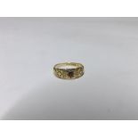 Late Victorian hallmarked 18ct Gold Ring, the engraved front set with a centre small red stone,