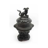 A Meiji Period Cast Metal Koro, the pierced lid applied with a temple dog handle, the body below