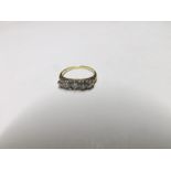 Early/mid-20th Century unmarked yellow metal Ring, the carved boat shaped setting featuring five old