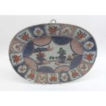 A Chinese Platter of oval form, the border painted in iron red, famille verte, underglaze blue