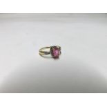 Hallmarked 9ct Gold centre oval pink stone and six small Diamond oval cluster Ring