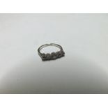 20th Century high grade precious metal Ring, line set with five graduated old cut Diamonds,