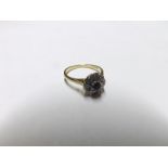 Late 20th Century hallmarked 18ct Gold Ring of flower head design, featuring centre small dark
