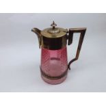 A late 19th or early 20th Century Water Jug with silver plated mounts and light cranberry cut
