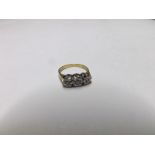 20th Century hallmarked 18ct Gold Engagement Ring set with three small Brilliant Cut Diamonds