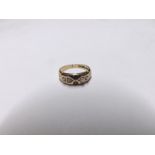 Late Victorian hallmarked 15ct Gold Ring, the curved front panel set with two small red stones and