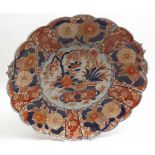 A Japanese Imari Circular Plate with a hipped rim and typically decorated in traditional colours