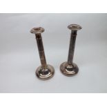 A pair of 19th Century Silver Plated on Copper Tapering Circular Candlesticks, with loaded bases,