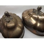 Two large 19th Century oval Silver Plated Meat Covers, fitted with artichoke handles and decorated