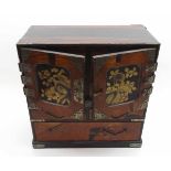 A Chinese Rosewood Simulated Table Top Cabinet, two doors with central gilded panels enclosing a