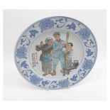 A Chinese Republic Period Circular Plate, the centre painted in colours with scene of solider and