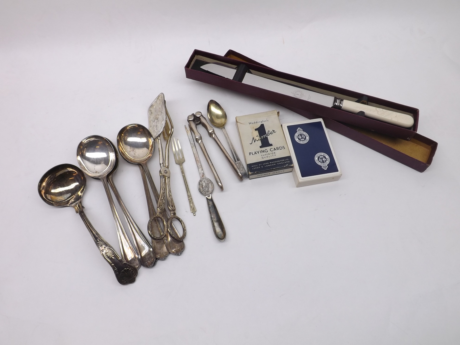 A bag of assorted mixed Silver Plated Cutleries, including various spoons, asparagus tongs, also