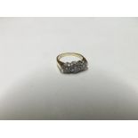 Precious metal Ring set with three graduated Brilliant Cut Diamonds of approximately .4ct total