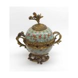 A Japanese Jardini¦re of covered globular form applied with gilt metal finial, handles and mounts,