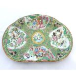 A Canton Famille Rose Kidney-shaped Dish, typically painted in typical palette with panels of exotic