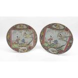 A pair of 18th Century Chinese Plates, centres each painted in colours with scenes depicting young