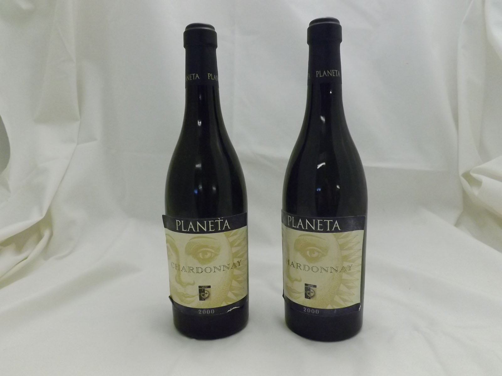 Twelve bottles comprising six bottles Planeta Chardonnay 2000 and six bottles Planeta Santa