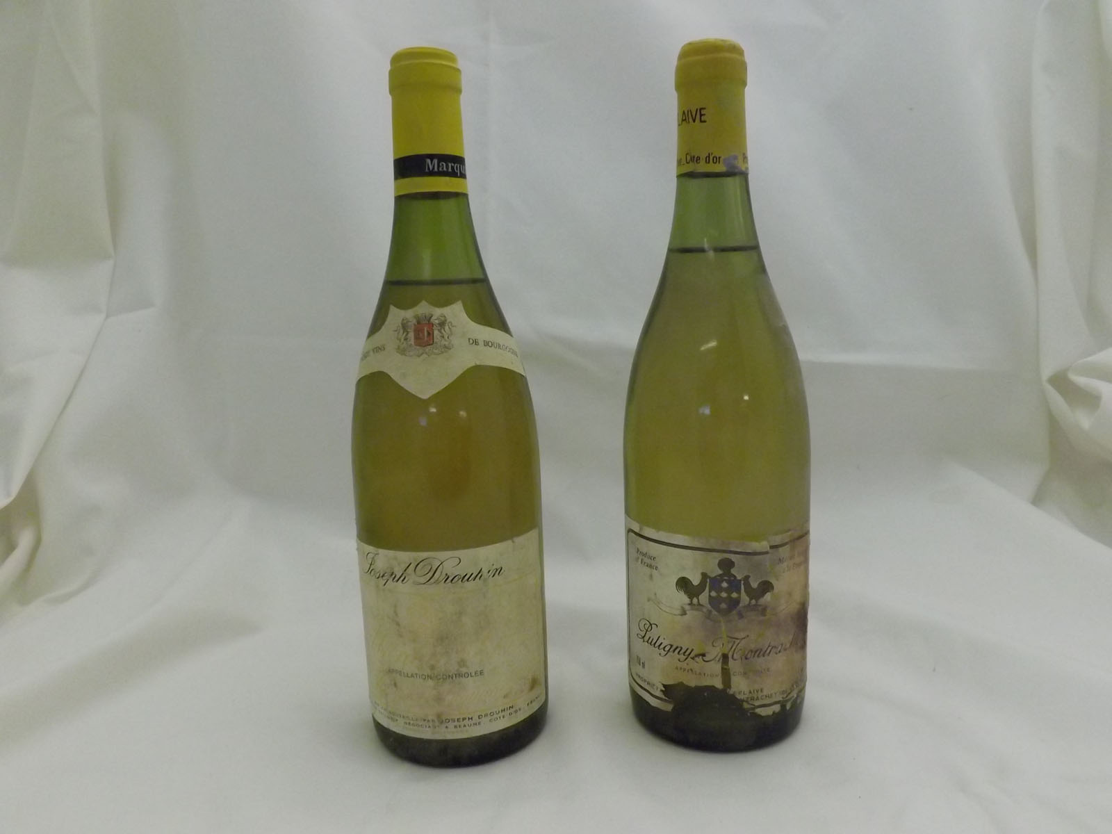 Nine bottles comprising 1 x Laboure-Roi St-Veran 1990, 2 x Montrachet Joseph Drouhin 1986, 3 x