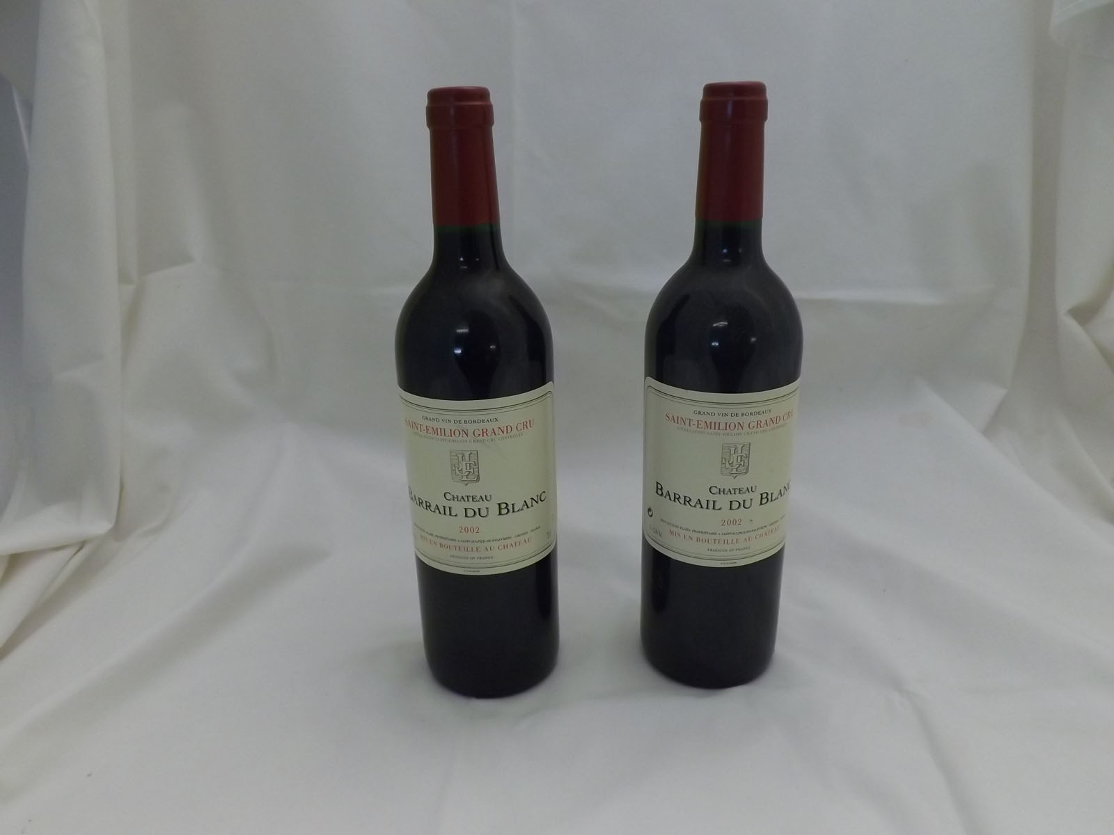 Twelve bottles of Chateau Barrail du Blanc, St Emilion Grand Cru 2002