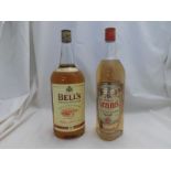 Two bottles comprising 1 + ltr Bells Extra Special Old Scotch Whisky and 1 ltr William Grant?s