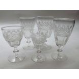 Suite of early 20th Century clear drinking glasses decorated with cut detail and knopped stems,