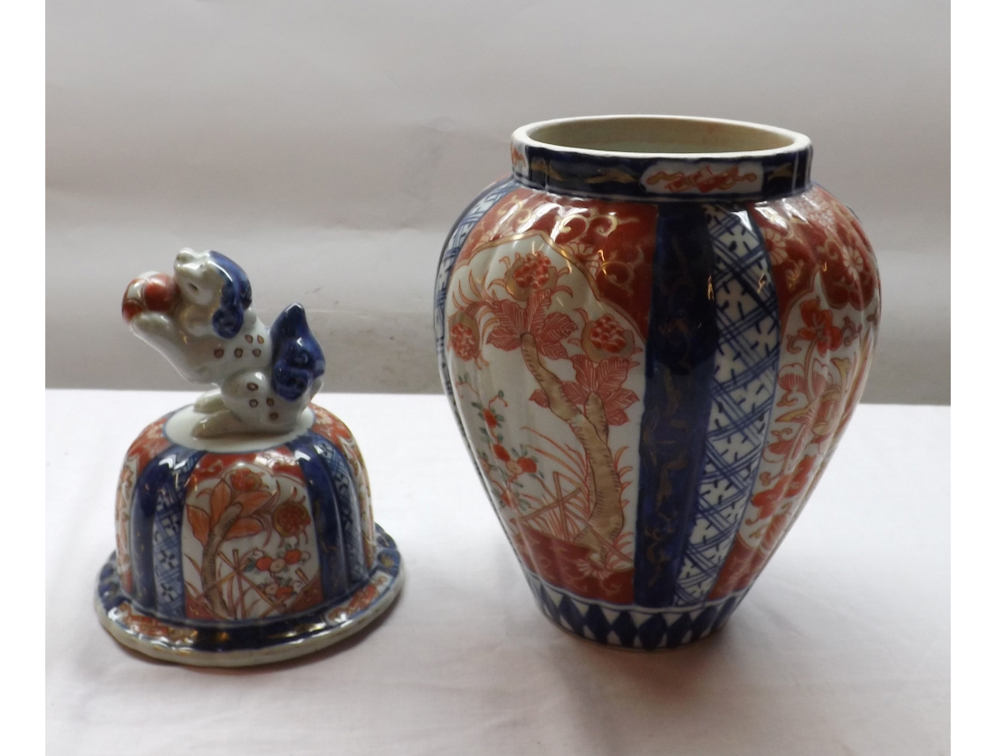 A Japanese Imari covered Jar of reeded tapering circular form, typically decorated in traditional - Image 2 of 2