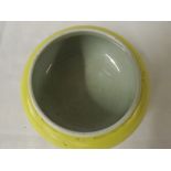 An Oriental Yellow Glaze Circular Pot of compressed form, base with 6 character mark, 5.25"