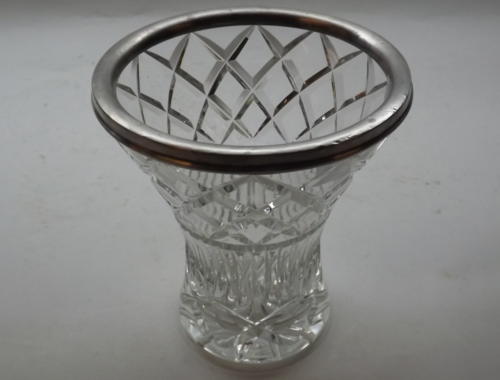 A clear cut glass Vase of tapering round form, fitted with London hallmarked Silver collar, 8" high