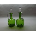 Pair of Victorian green and clear glass spirit Decanters of round form, 10" high