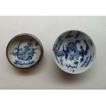 A Chinese Small Circular Bowl, the centre decorated in underglaze blue with dragons and smoke