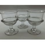 Set of three 19th Century clear glass Rummers of circular form, decorated with raised band raised on