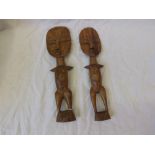 Pair of South African carved Hardwood tribal fertility dolls, 20th Century, 12" long (2)