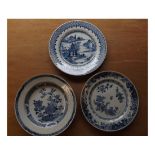 A Nankin Bowl and two Plates, each decorated in underglaze blue with various designs, all 9"