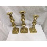 A pair of large Brass Candlesticks of knopped form, raised on octagonal bases, together with a