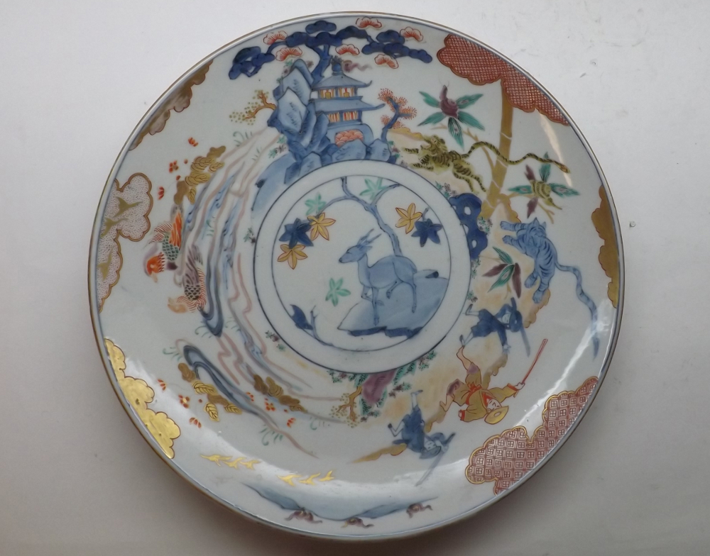 A 20th Century Chinese Charger, decorated in the Arita manner with scene of figures, animals and