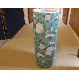 A Chinese cylindrical Stick Stand, painted in grey and white with all over flowering foliage on a