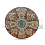 A Japanese Imari Large Charger, typically decorated in traditional colours with a radiating floral