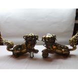 A pair of heavy Chinese Gilded Bronze Firedogs, modelled as Dogs of Fo (Temple Dogs), one moulded