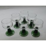 Set of six 20th Century wine glasses with clear bowls and green ribbed stems raised on circular