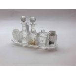 Clear cut glass Cruet fitted with five bottles/jars, 9.5"  long