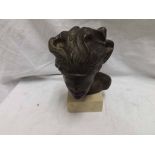 Indistinctly signed Bronze patinated study of head and shoulders of a woman wearing a blindfold on a