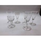 Six 18th/19th Century clear dram glasses to include an example etched with Vine and Grape engraving,