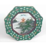 A late 20th Century Japanese large octagonal Dish, the centre painted in colours with a pagoda and