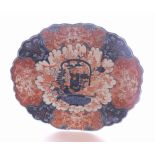 A large Japanese Imari Charger of shaped circular form, decorated in traditional colours with
