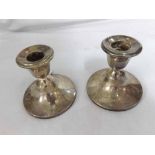 A pair of George V Squat Silver Candlesticks of circular loaded form, hallmarked Birmingham 1922,