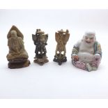 Mixed lot comprising three Oriental soapstone figures and a further 20th Century model Buddha,