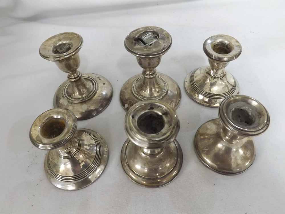 A Mixed Lot of six assorted small Dressing Table Candlesticks of round form, with loaded spreading