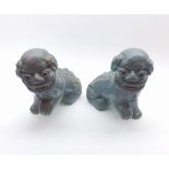 Pair of Chinese Temple Dogs, decorated in a mottled turquoise glaze, 7" high   60-80