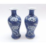 A near pair of Chinese Balustered Spill Vases, decorated in underglaze blue with prunus blossom