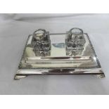 A George V Silver Mounted Desk Stand, rectangular form, fitted with two cut glass ink bottles,